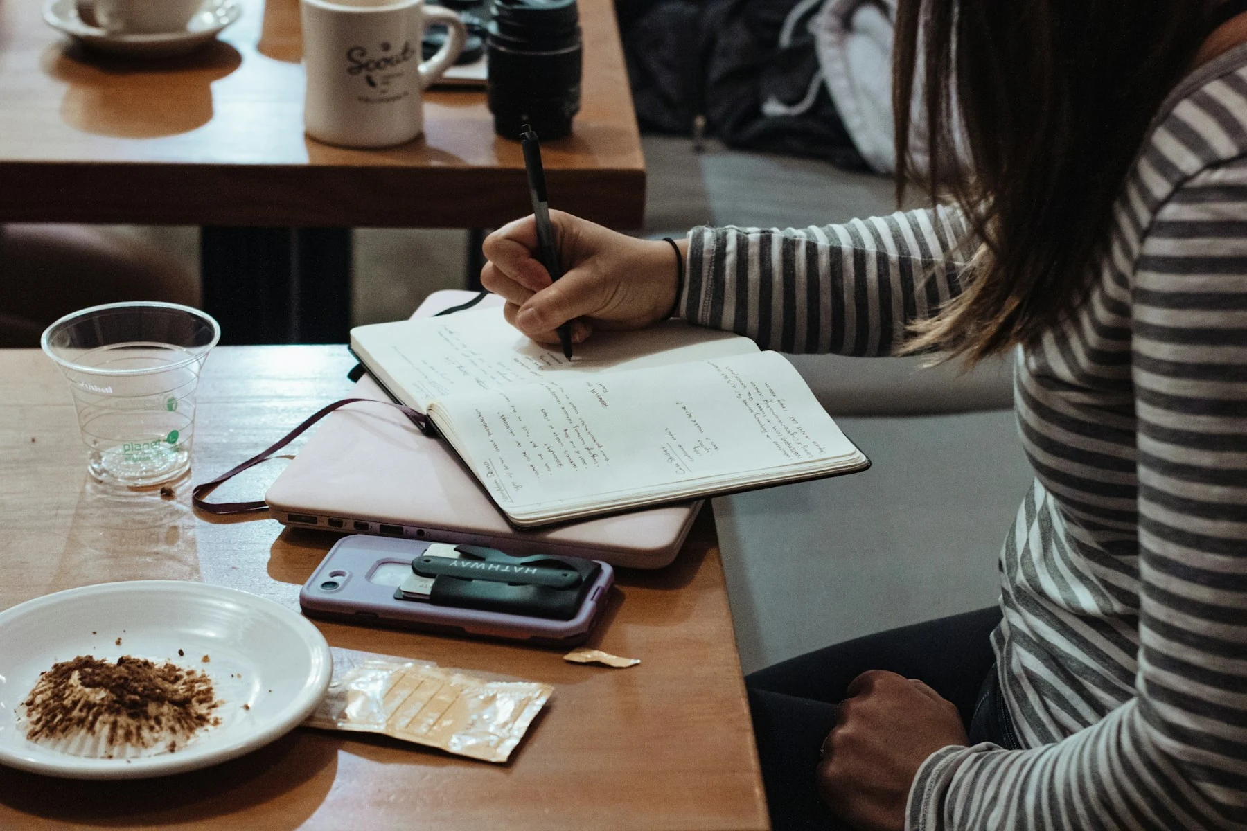 Writing in a study notebook