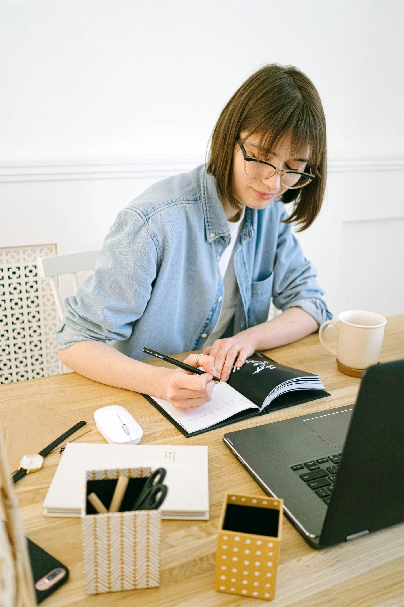 A person writing notes
